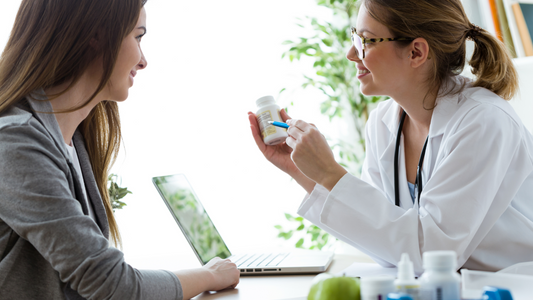 A health supplement specialist is talking to a client advising her on supplements for quality care