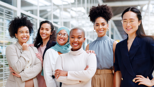 Photo of a group of women from all ethnicities standing together as a team of powerful women 